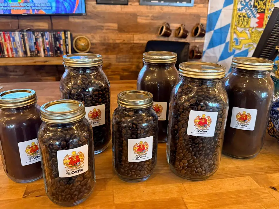 Mason jars of fresh Der Hoffskeller coffee, whole bean and ground